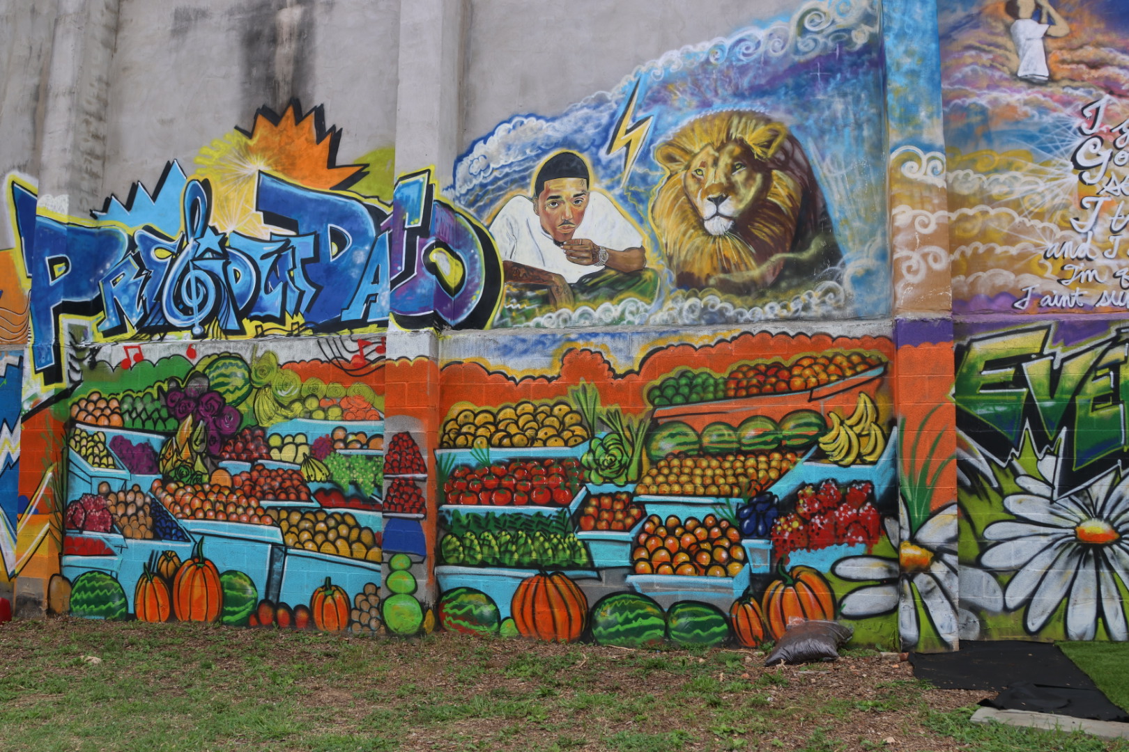 Baltimore community mural of a fruit stand painted alongside the Prezident Davo tribute