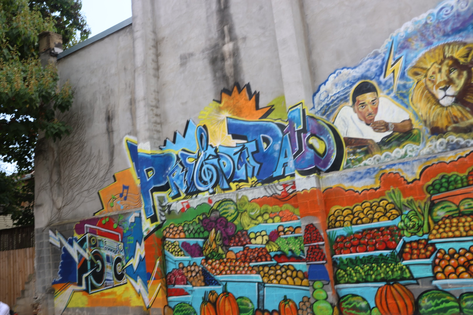 Baltimore graffiti mural reading Prezident Davo, featuring a lion and a painted portrait of Davo